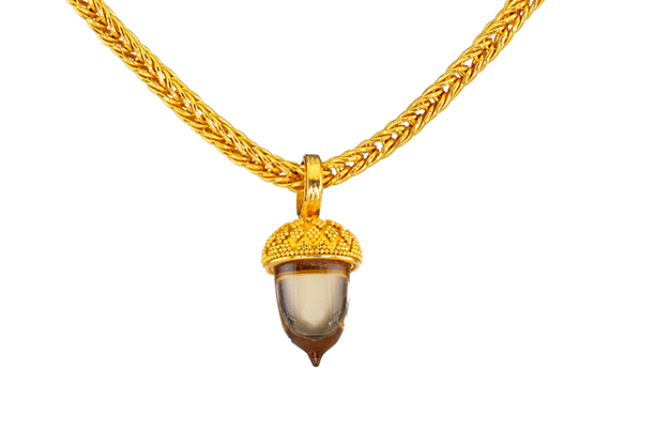 Granulated gold acorn cap with citrine body shown hanging from a chain; chain sold separately